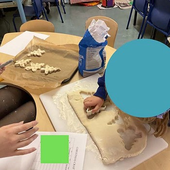 A child making christmas tree biscuits