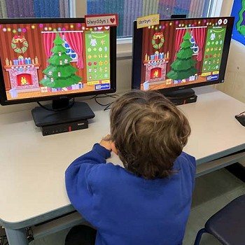 A child doing work on the computer
