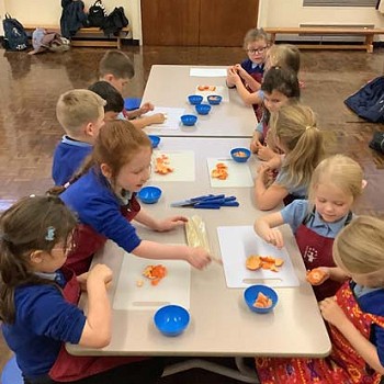 Children working together to gain experience on food